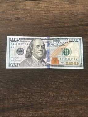 US $100 Bill - Benjamin Franklin Note with binary serial number of 1s and 0s